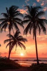 Sunset over a tropical beach with silhouetted tall palm trees and vibrant orange and pink sky reflected in the calm ocean water