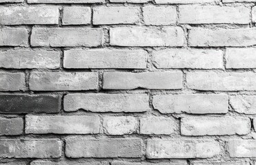 Close-up image of a textured brick wall with varying shades of gray creating a rustic and aged appearance
