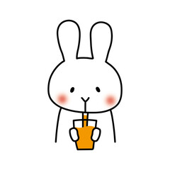 オレンジジュースを飲む白いうさぎ