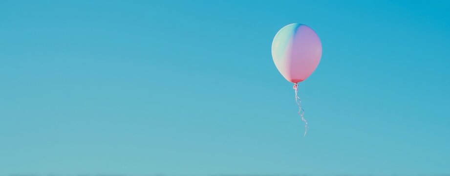Floating balloon in clear blue sky aerial perspective serenity conceptual nature photography