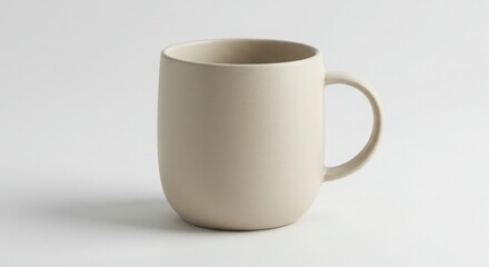 Obraz premium Minimalist ceramic coffee mug mockup on plain studio background, high-resolution lighting