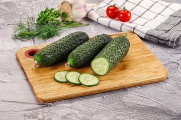 Raw green cucumbers with slices