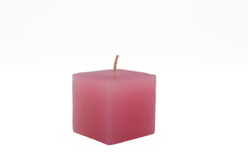 Pink rose scented candle on a white background