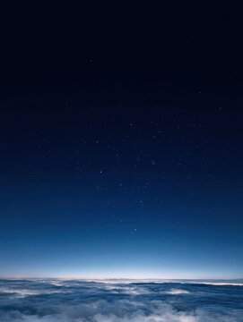 Starry night sky above vast sea of clouds with blue gradient horizon, tranquil celestial landscape representing universe, astronomy, cosmos, nature, peaceful atmosphere and dreamy cosmic environment f