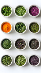 Colorful assortment of herbs and spices in bowls arranged neatly on a white surface