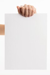 Hands holding paper blank for letter paper