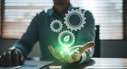 Business professional holding glowing digital gears representing technology innovation and process management in a modern office setting for corporate growth