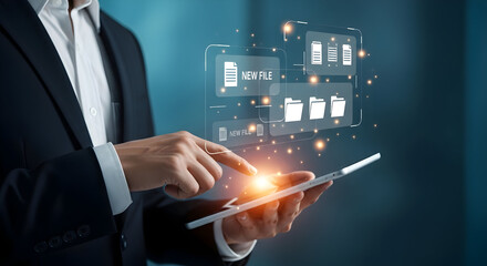 Businessperson using a digital tablet with floating icons representing cloud storage and file management technology for modern data handling solutions