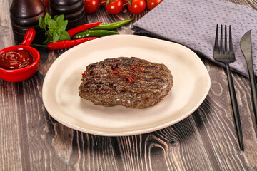 Grilled beef burger cutlet with sauce