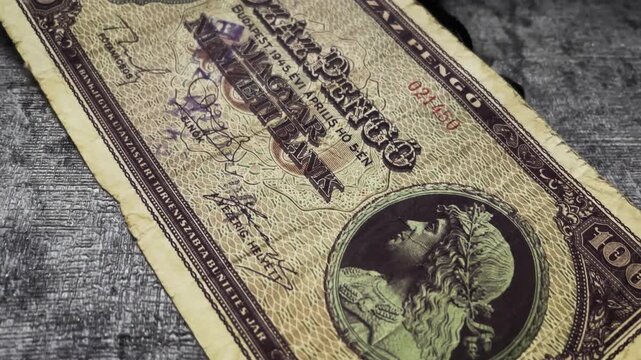 Ancient hungarian pengo vintage banknote depicting 100 pengo value from 1945 budapest. Ideal for historical, currency, and collectible concepts.