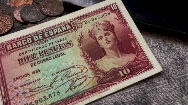 Ten peseta banknote of Spain from 1935, depicting historical currency design. Suitable for illustrating Spanish financial history and vintage monetary collectibles.