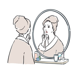 鏡の前に立つバスローブ姿の女性　トラブル