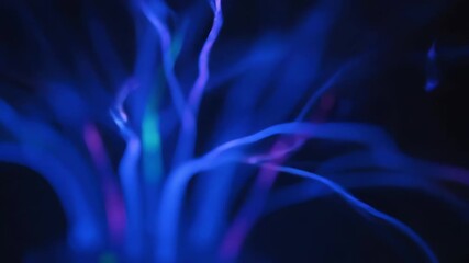 Seamlessly looping video of a pulsating neon energy field with organic, flowing tendrils of light ambient, soft, art