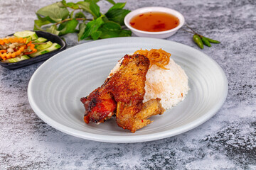 Spicy roasted chicken wing with rice