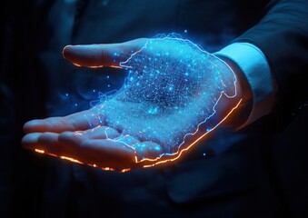 Close-up of a businessman's hand holding a glowing blue digital hologram of the African continent with interconnected network nodes representing technology and connectivity