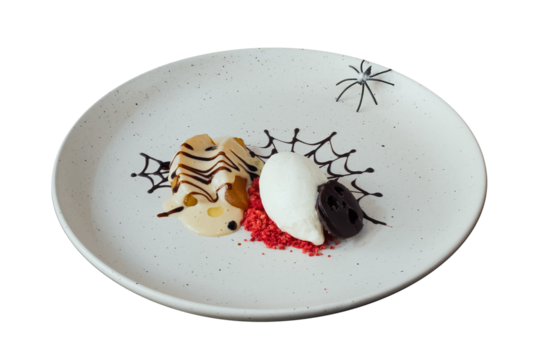 Halloween Dessert Delight: A creative and delicious Halloween-themed dessert is artfully arranged on a decorated plate, featuring various sweet treats.