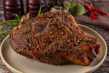 Baked beef steak on the bone
