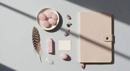Spiritual Journaling Flat Lay with Rose Quartz Crystals and Feathers