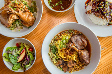 Culinary Composition: An overhead shot presenting a diverse assortment of appetizing dishes, each...