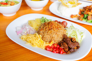 Exquisite Culinary Composition: A beautifully arranged plate presents a culinary masterpiece of Southeast Asian cuisine, showcasing vibrant colors and textures with a delicious appeal.