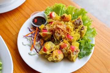 Golden Dim Sum Delights: A mouthwatering plate of golden dim sum, meticulously arranged alongside...