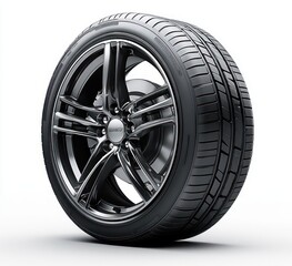 Obraz premium Close-up of a modern black alloy car wheel with a detailed tire tread on a neutral white background