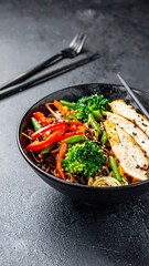 Vibrant bowl of soba noodles with chicken and vegetables