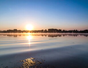 Peaceful sunrise over a calm lake