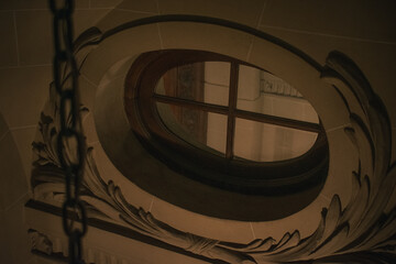 Ornamental Oval Window Frame in Historic Building Interior
