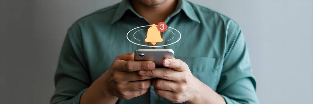 Man checks phone with glowing notification bell icon symbolizing important alerts and app updates, creating a sense of urgency and engagement