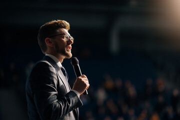 Businessman giving keynote speech at conference