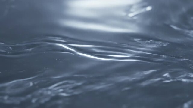 A fluid starlight glow resembling molten silver or quicksilver, slowly morphing and flowing across the screen in a seamless loop fluid, wonder, white