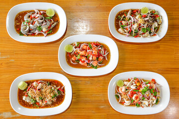 Culinary Delight: A vibrant array of prepared dishes presented on individual plates, showcasing fresh ingredients and tempting flavors