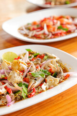 Exquisite Culinary Arrangement:  Close-up shot of artistically arranged gourmet plates showcasing seafood delicacies