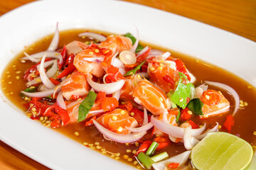Spicy Seafood Delight: A vibrant and tantalizing presentation of a Thai-inspired dish, boasting succulent seafood, a medley of fresh vegetables, and a zesty lime wedge.