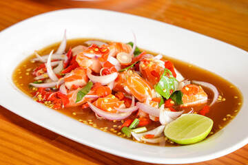 Vibrant Seafood Dish: A close-up studio shot of a colorful seafood dish on a white plate, showcasing fresh ingredients and culinary artistry, the culinary delights.