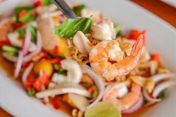 Seafood Salad: A close-up shot showcases a vibrant seafood salad with fresh ingredients and delectable flavors, ideal for food-related design and culinary inspiration.
