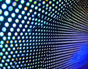 Close-up of a vibrant LED screen, displaying a gradient of blue and teal lights in a grid pattern