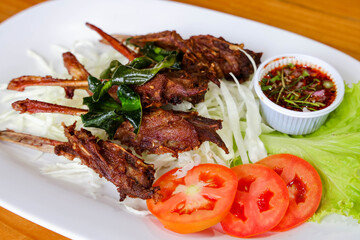 Sizzling Skewers: A culinary delight featuring tantalizing skewers of savory meat, artfully arranged with fresh vegetable, tempting sauces, showcasing the freshness of ingredients.