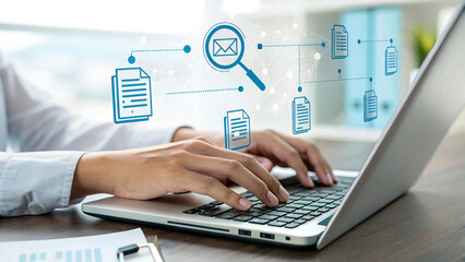 Email Management and Digital Workflow A professional's hands on a laptop with a glowing overlay of a magnifying glass, email icon, and documents