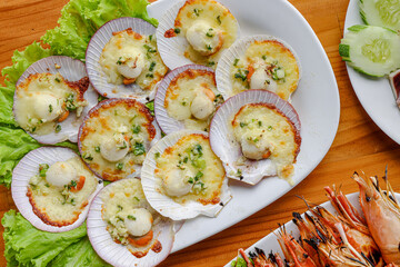 Scallops Appetizer Delight: A mouthwatering array of cooked scallops, artistically arranged and...