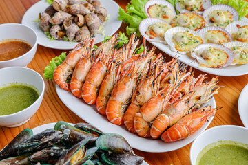 Seafood Extravaganza: A tantalizing array of grilled shrimp, succulent scallops, and other delectable seafood dishes, artistically arranged for a culinary feast.
