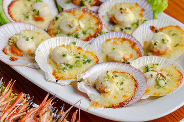 Scallops Delight: A close-up showcases a mouthwatering dish of baked scallops, elegantly arranged...