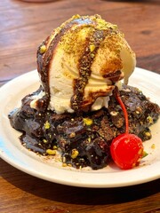 Crispy, golden waffles topped with creamy ice cream, creating a perfect balance of warm and cold, crunchy and smooth. A delightful dessert or breakfast treat, with toppings like fruits or syrup.
