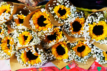 Wedding bouquet of sunflower on a wooden background. Top view with copy space