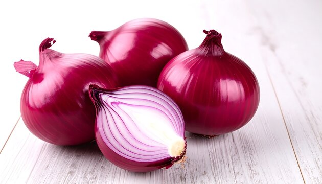 Fresh red onions on white wood