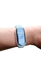 A close-up shot of a hand wearing a blue smartband against a white background. The smartband displays workout information on its screen.