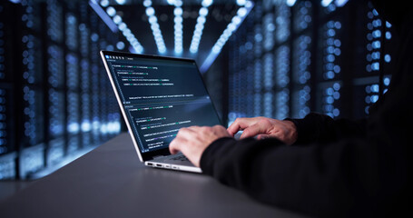 Man In Dark Hoodie Hacks Into Online Server