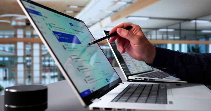 Elderly Man Multitasking With Email App On Laptop
