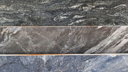 Three granite slabs with unique patterns and shades of gray, showcasing natural stone textures.